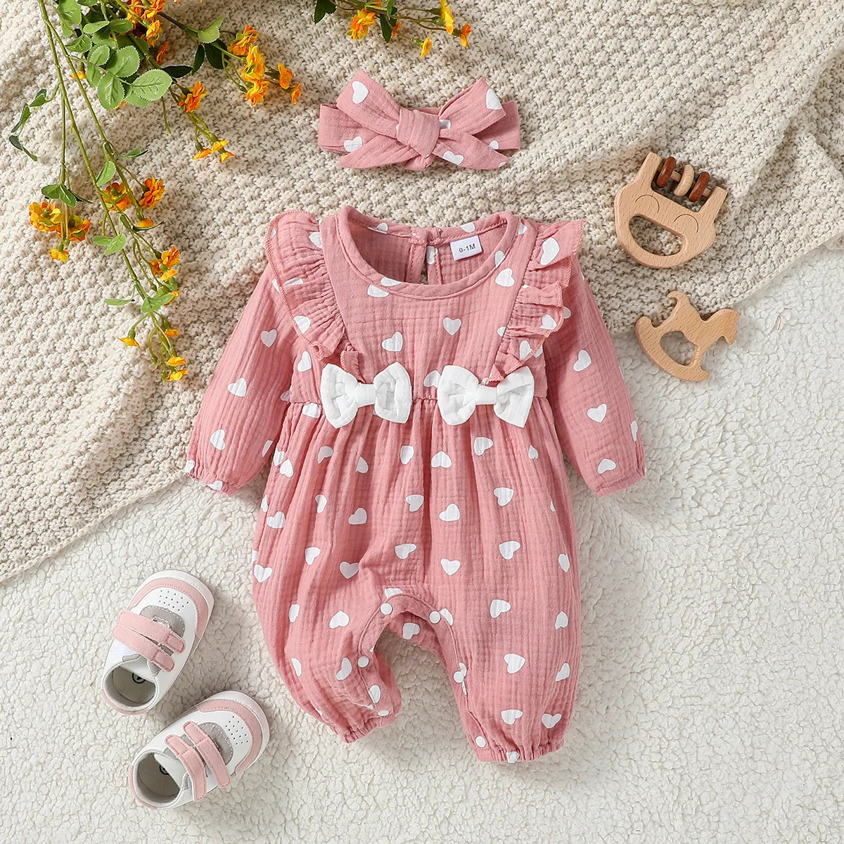 Macacão infantil feminino manga longa estampa floral com laço