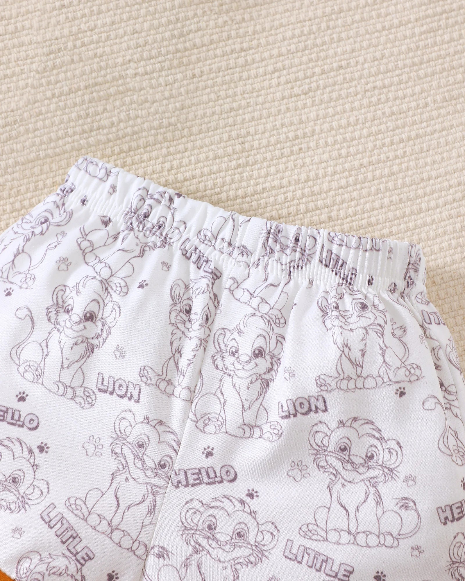 Conjunto Rei Leão Body + Shorts + Touca