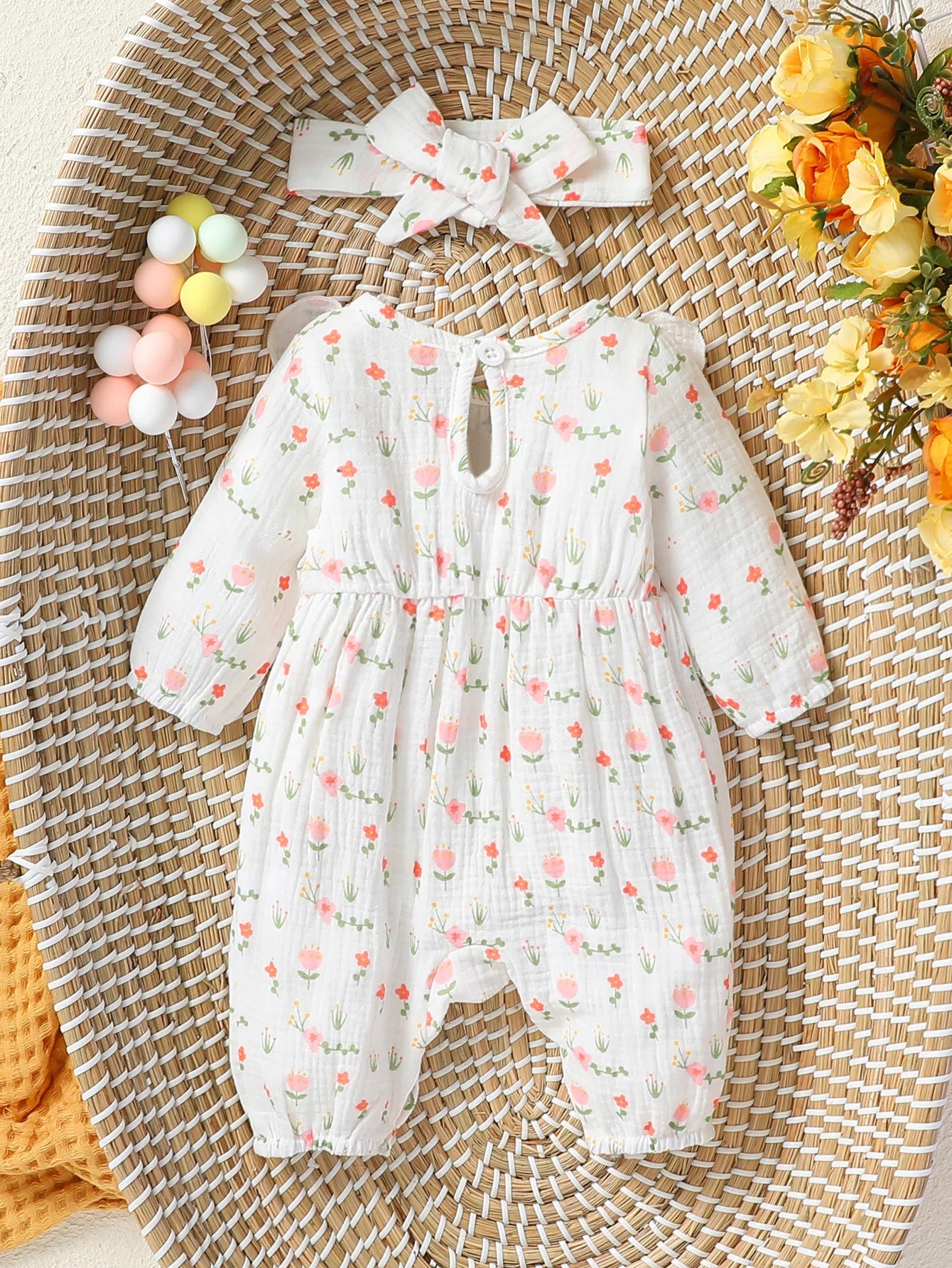 Macacão infantil feminino manga longa estampa floral com laço