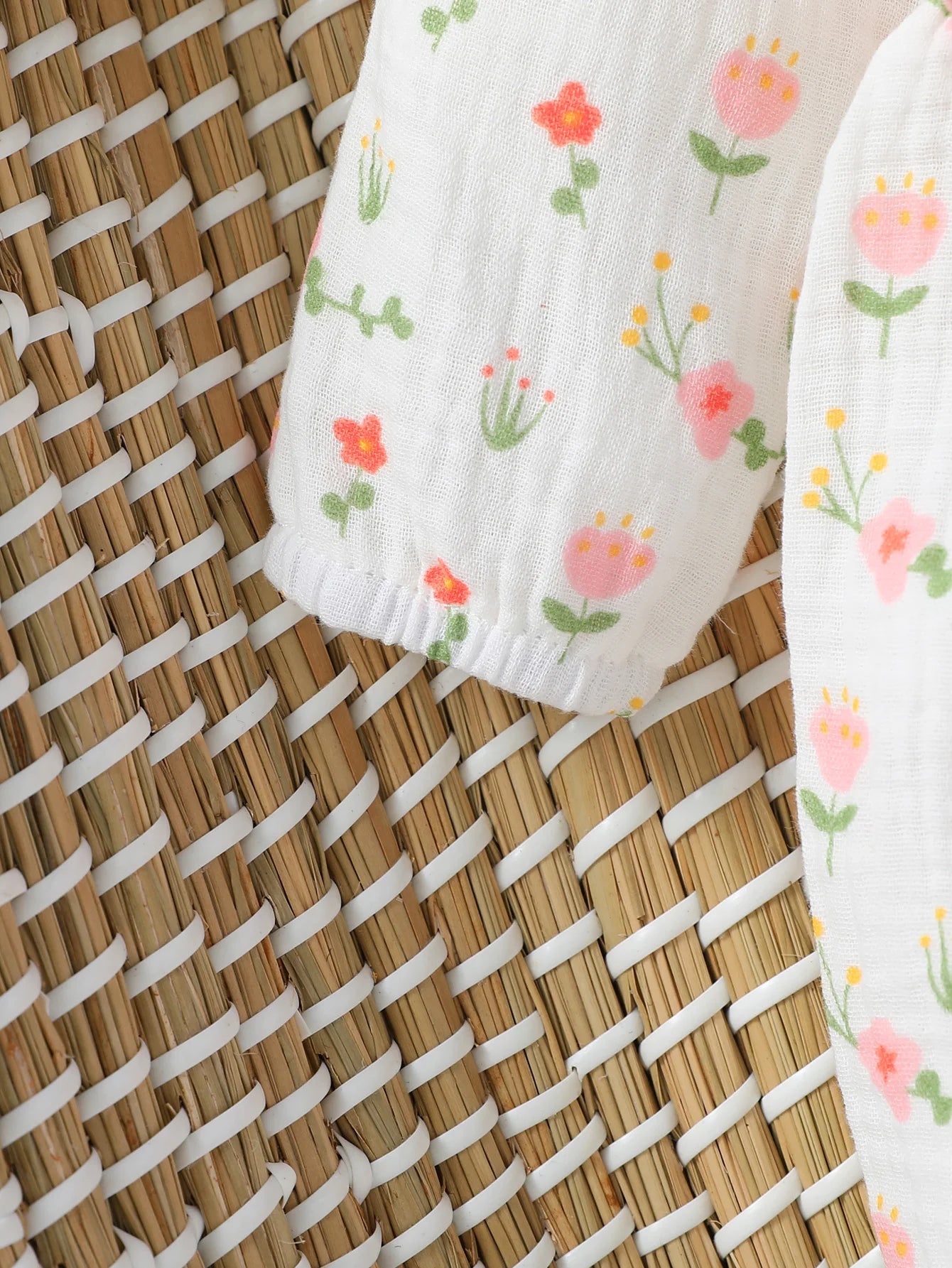 Macacão infantil feminino manga longa estampa floral com laço
