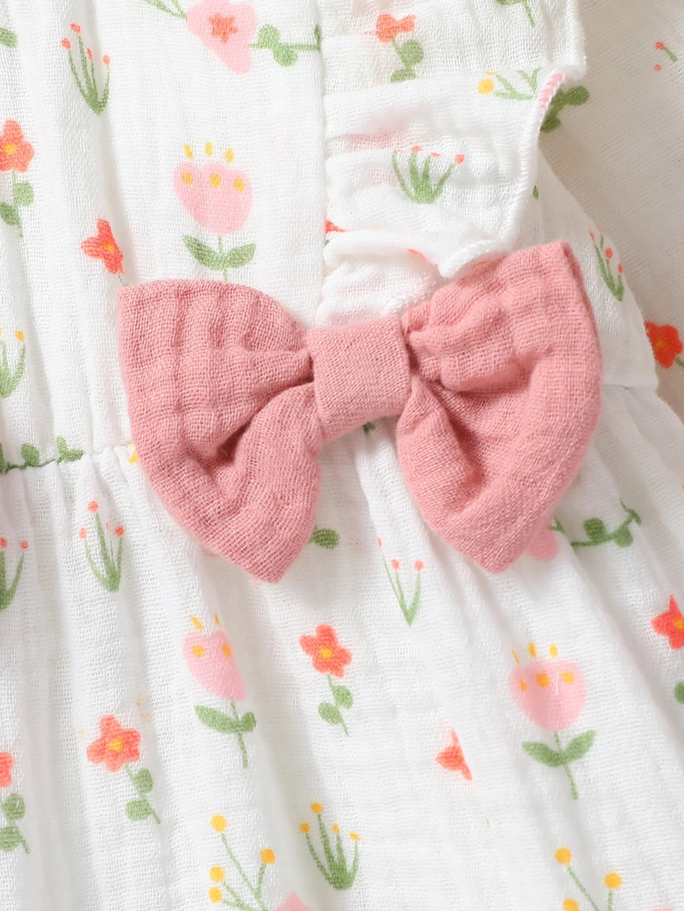 Macacão infantil feminino manga longa estampa floral com laço