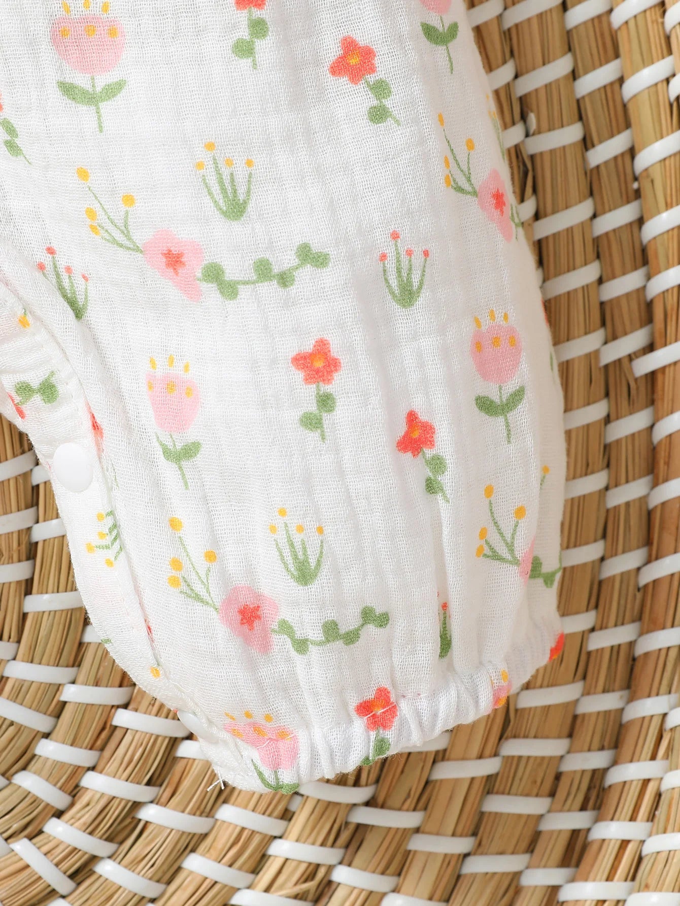 Macacão infantil feminino manga longa estampa floral com laço